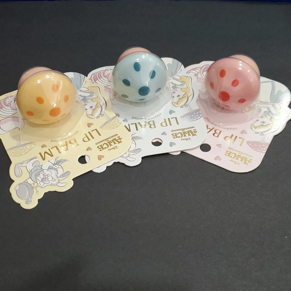 Disney's Alice in Wonderland raspberry vanilla and coconut scented lip balms new